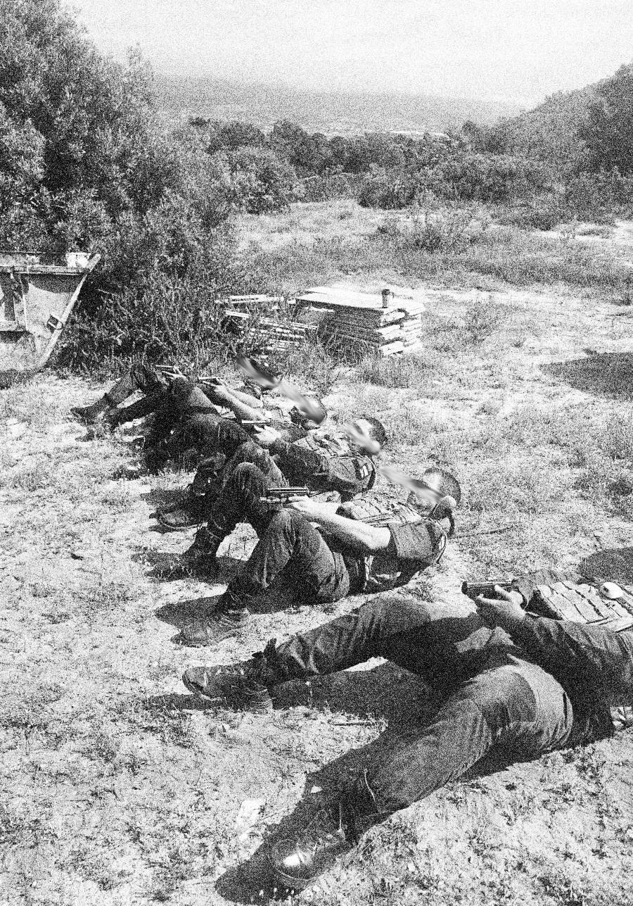 ONE officers on a firearms training drill, shooting from the ground