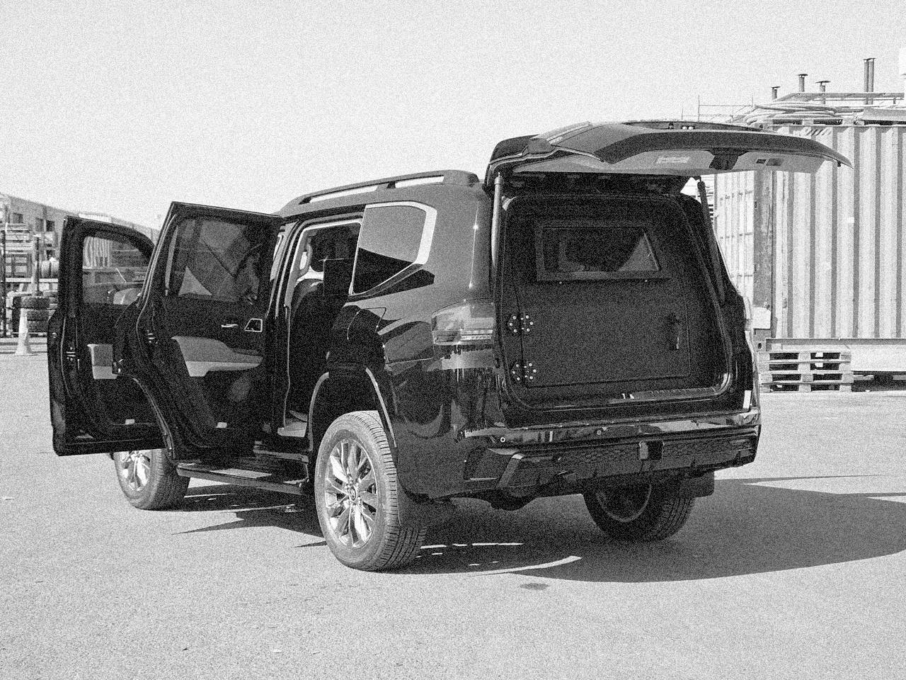 Armoured SUV used for VIP close protection, with doors and tailgate open